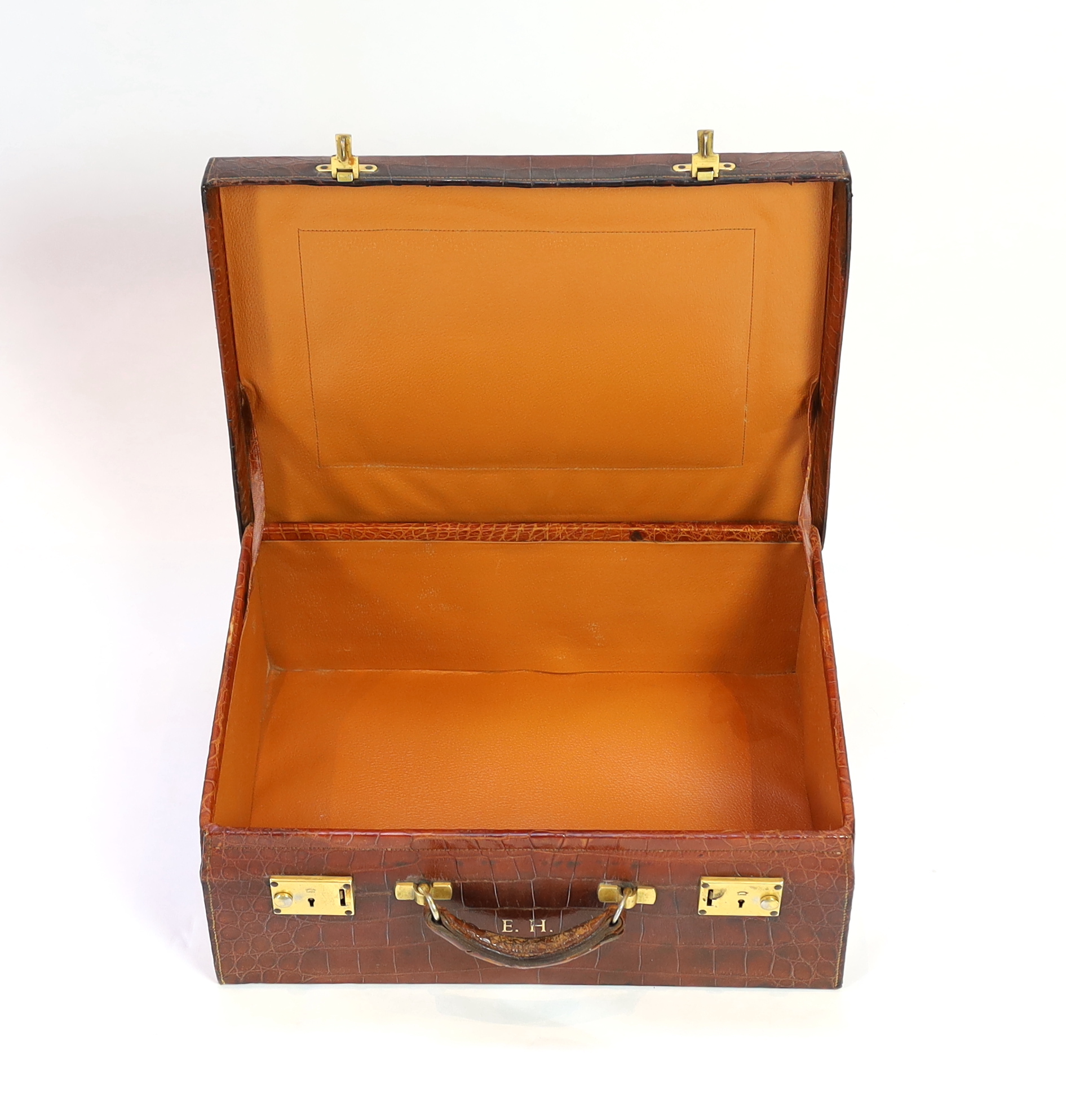 A 1920's crocodile skin suitcase, width 50cm, height 37cm, depth 19cm